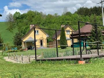 Фото номера Шале с двумя спальнями Дома для отпуска Domki nad Stawem Uherce г. Uherce Mineralne 70